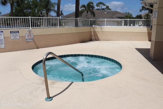 4889 Worthington Cir, Rockledge, FL 32955 - view of swimming pool featuring a hot tub and fence