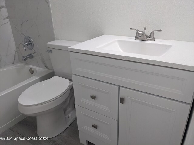 full bathroom featuring vanity, shower / washtub combination, and toilet