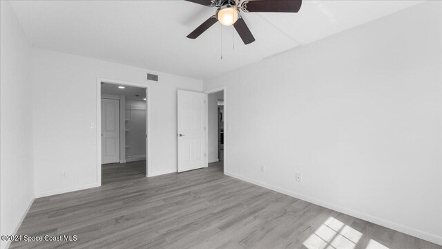 unfurnished bedroom featuring ceiling fan and wood-type flooring