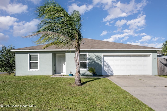 single story home with a front lawn and a garage