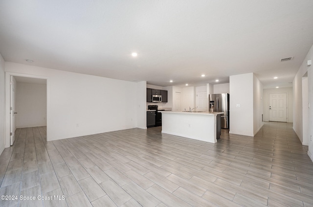 unfurnished living room featuring light wood-type flooring