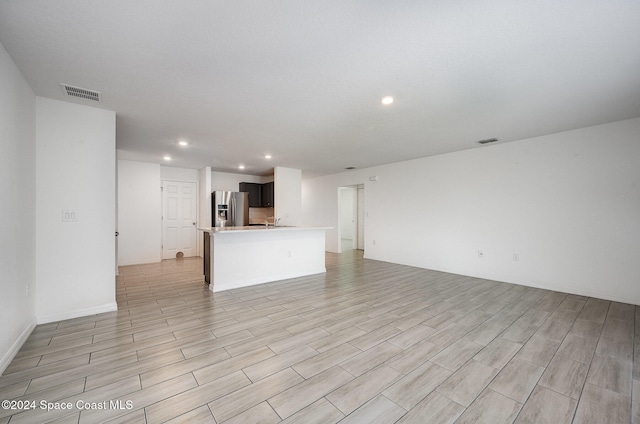 unfurnished living room with light hardwood / wood-style flooring