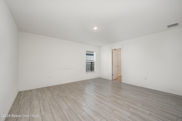 unfurnished room featuring light wood-type flooring