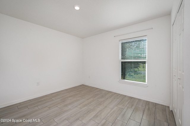 spare room featuring light hardwood / wood-style floors