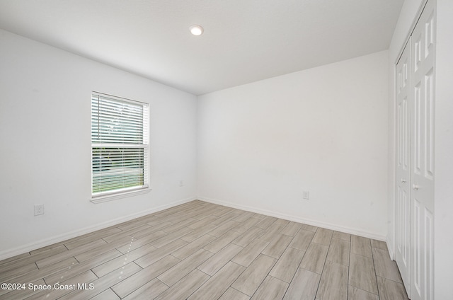 empty room with light hardwood / wood-style floors