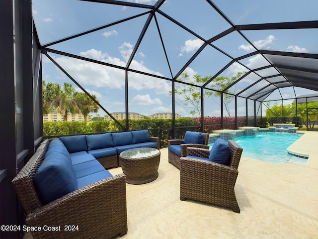 view of pool with an outdoor living space, glass enclosure, a patio, and pool water feature