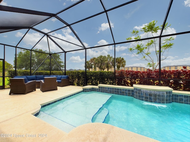 view of pool featuring outdoor lounge area, glass enclosure, and a patio area