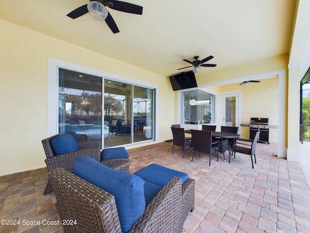 view of patio featuring area for grilling and ceiling fan