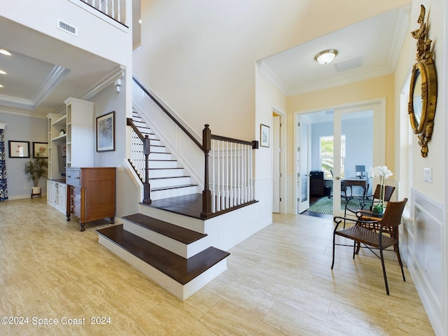 stairway featuring crown molding