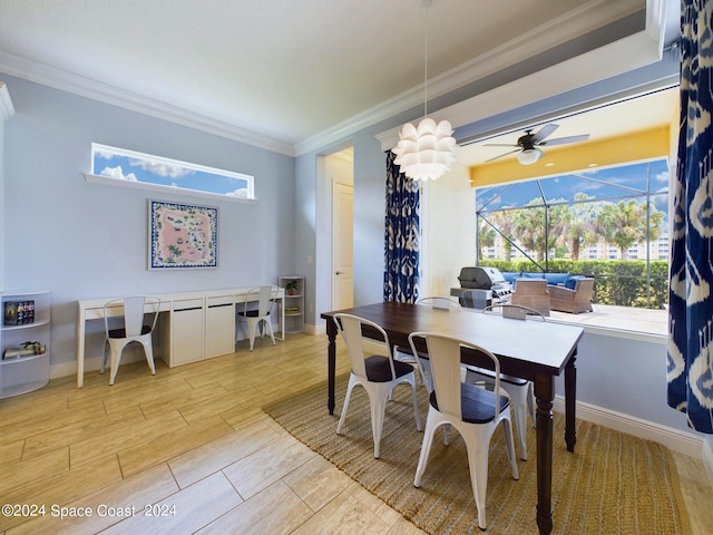 dining area featuring crown molding