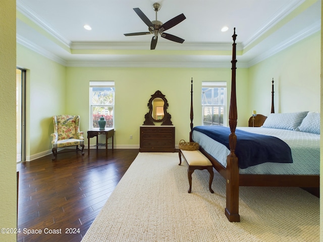 bedroom with dark hardwood / wood-style floors, ornamental molding, and multiple windows