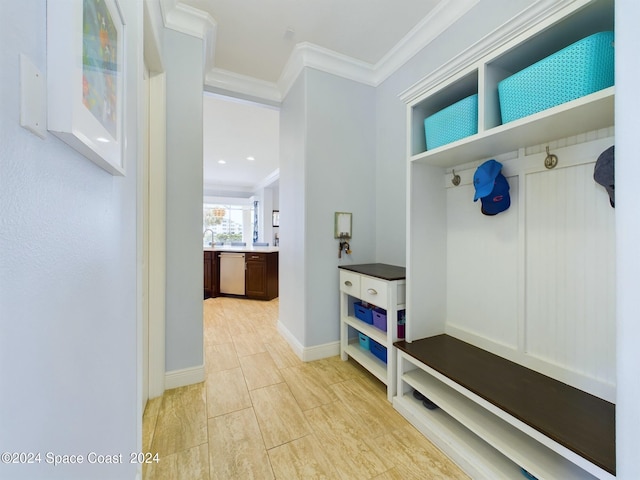 mudroom featuring ornamental molding