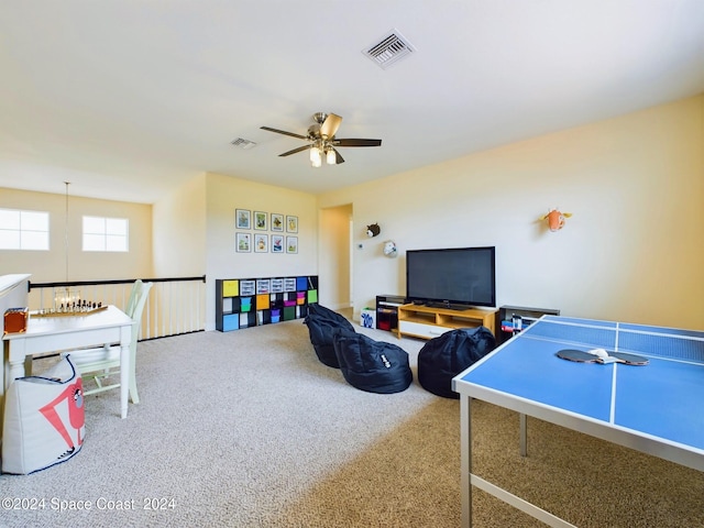 rec room with ceiling fan and carpet floors