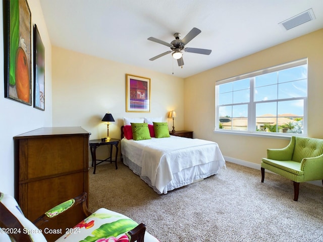 bedroom with ceiling fan and carpet flooring