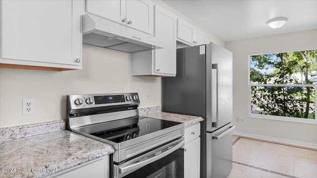 kitchen featuring stainless steel range with electric stovetop, light tile patterned flooring, light stone countertops, and white cabinetry