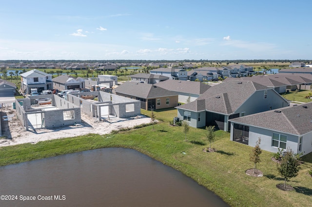 drone / aerial view with a water view