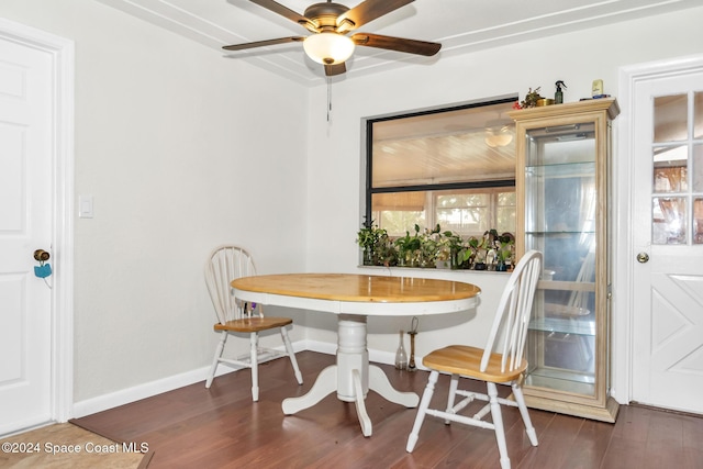 dining area with baseboards, a ceiling fan, wood finished floors, and breakfast area