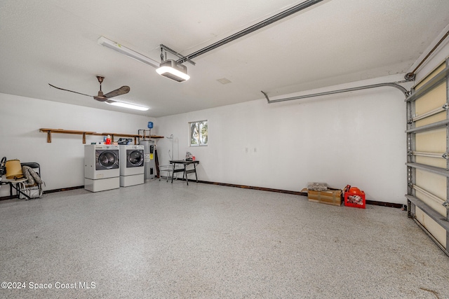 garage with water heater, washing machine and dryer, ceiling fan, and a garage door opener