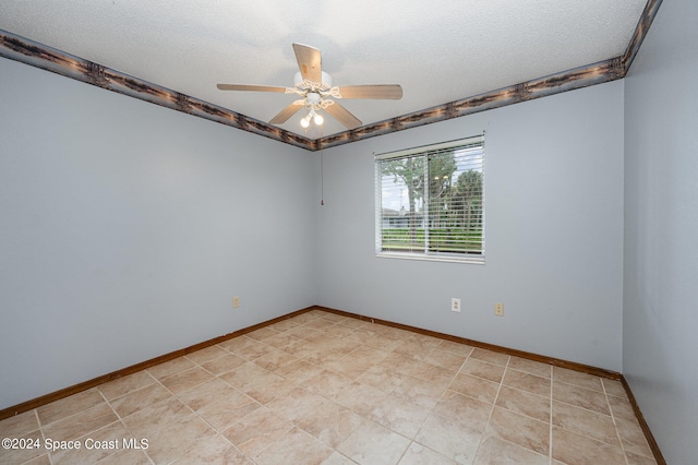 spare room featuring a textured ceiling and ceiling fan