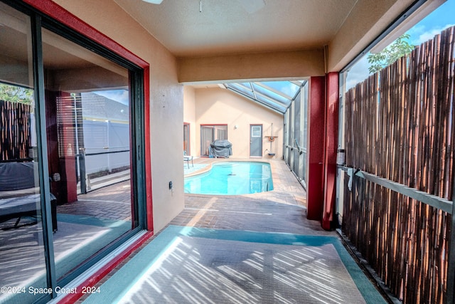 view of pool with a lanai and a patio area