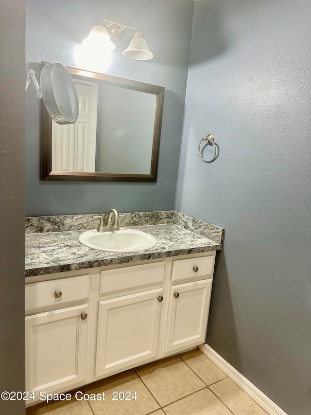 bathroom with vanity and tile patterned floors