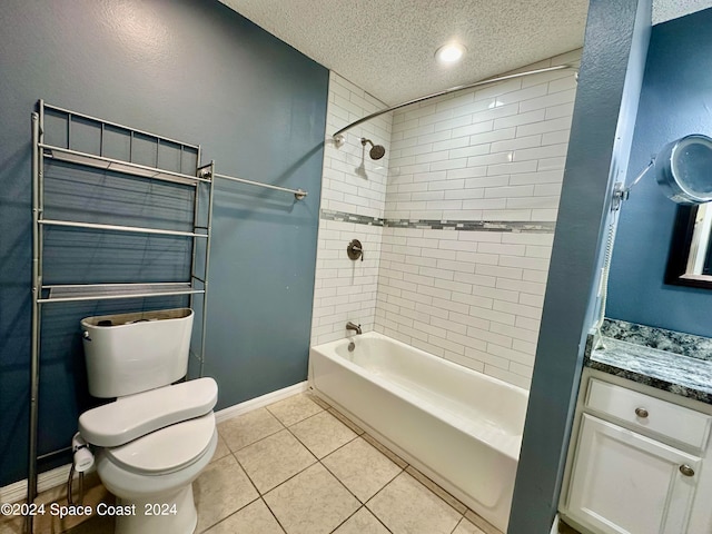 full bathroom with vanity, tiled shower / bath combo, tile patterned flooring, toilet, and a textured ceiling