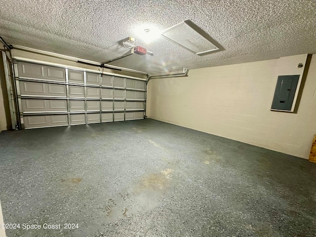 garage with electric panel and a garage door opener