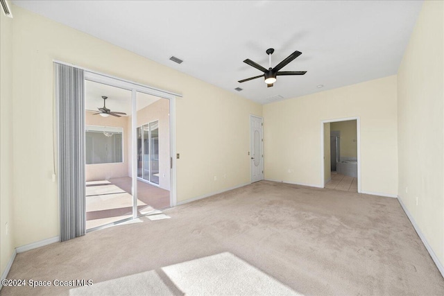 empty room featuring light colored carpet and ceiling fan