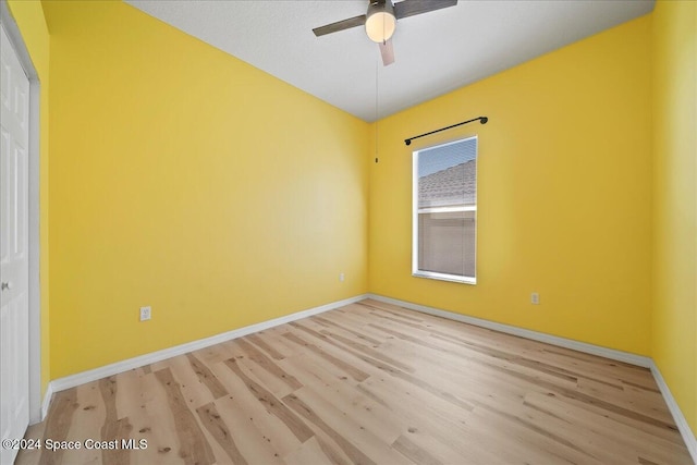 unfurnished room with light hardwood / wood-style flooring and ceiling fan