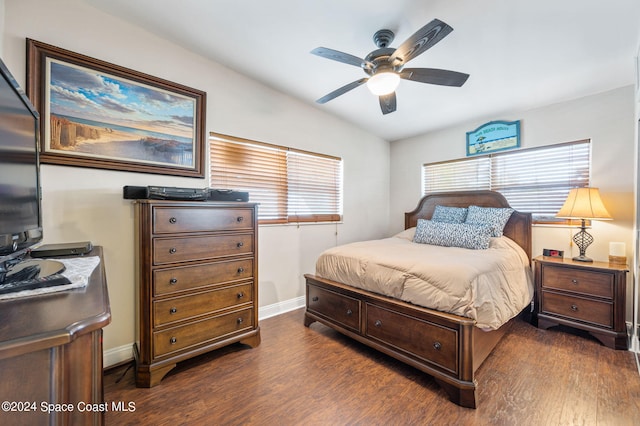 bedroom featuring ceiling fan and dark hardwood / wood-style flooring