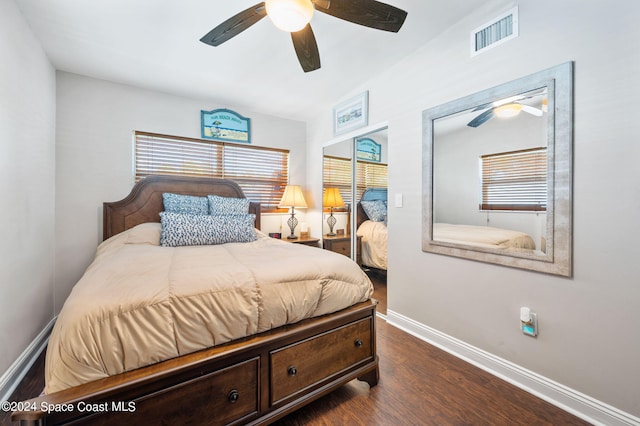 bedroom with dark wood-type flooring and ceiling fan