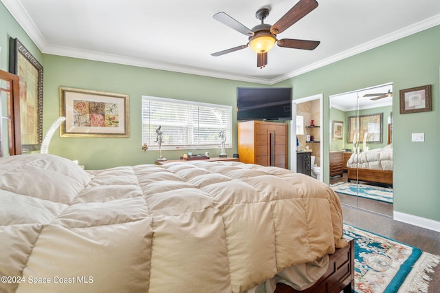 bedroom featuring a closet, ornamental molding, hardwood / wood-style flooring, and ceiling fan