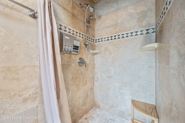 bathroom featuring a shower with curtain