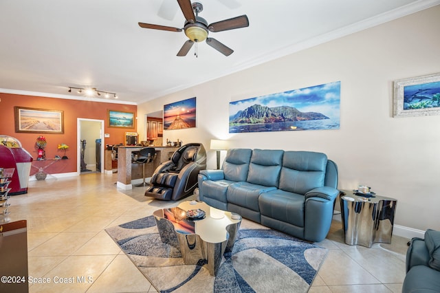 living room with ceiling fan, crown molding, and light tile patterned flooring