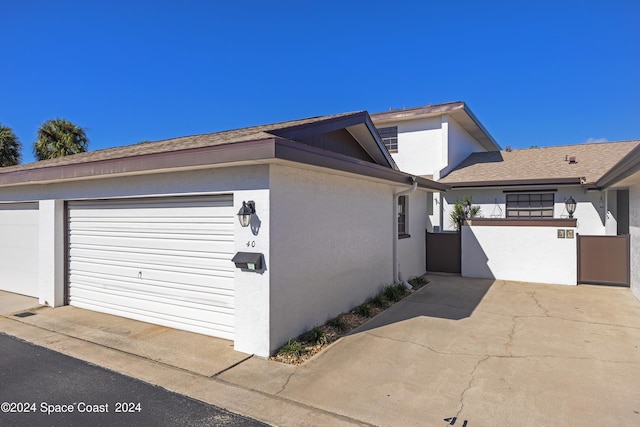 view of property exterior with a garage