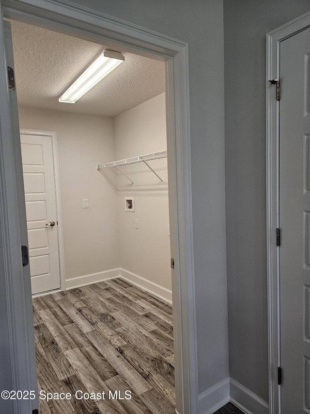 843 Geary St SW, Palm Bay, FL 32908 - laundry room with washer hookup, wood finished floors, a textured ceiling, and baseboards
