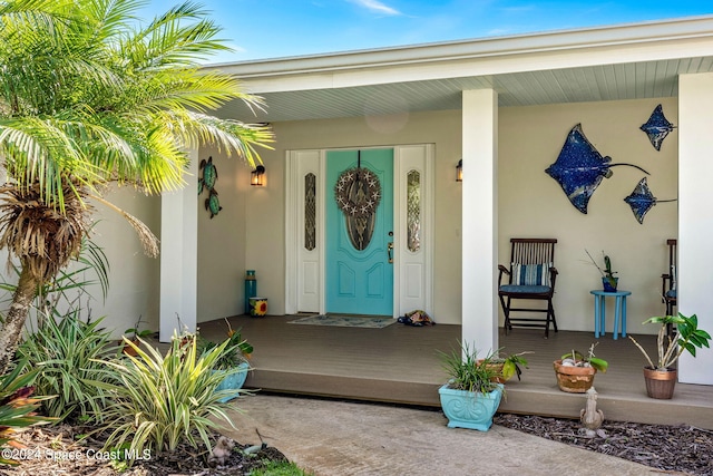 doorway to property with a porch