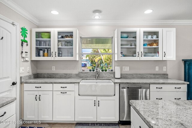 kitchen with ornamental molding, white cabinets, sink, and stainless steel dishwasher