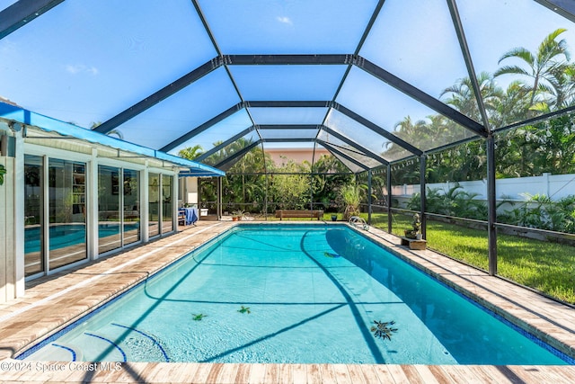 view of pool featuring a lanai and a patio