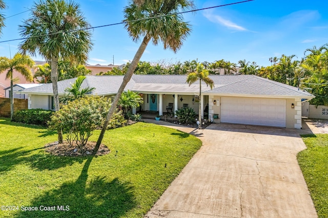 single story home with a garage and a front yard