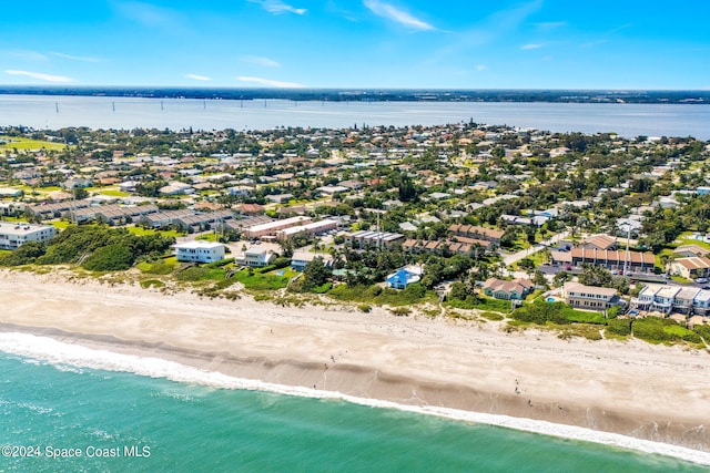 bird's eye view featuring a beach view and a water view