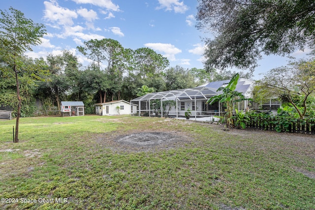 view of yard with a pool and a lanai