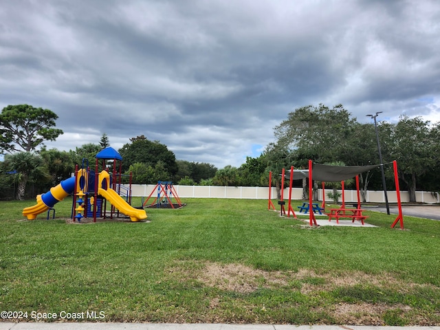 view of playground with a yard