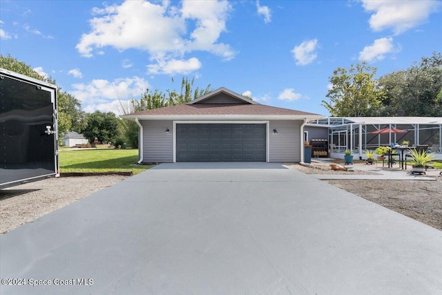 view of front of house featuring a front yard and a garage