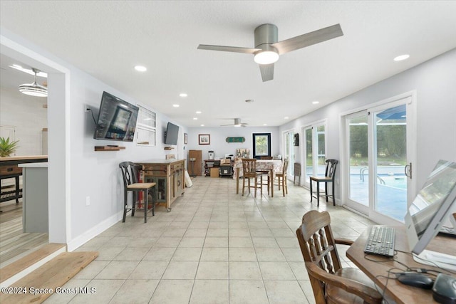 tiled dining room featuring ceiling fan