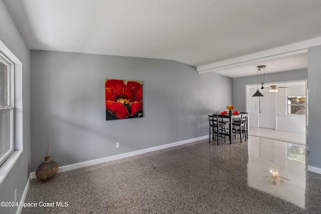 dining room featuring a textured ceiling and ceiling fan