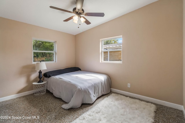 bedroom featuring lofted ceiling, carpet floors, and ceiling fan