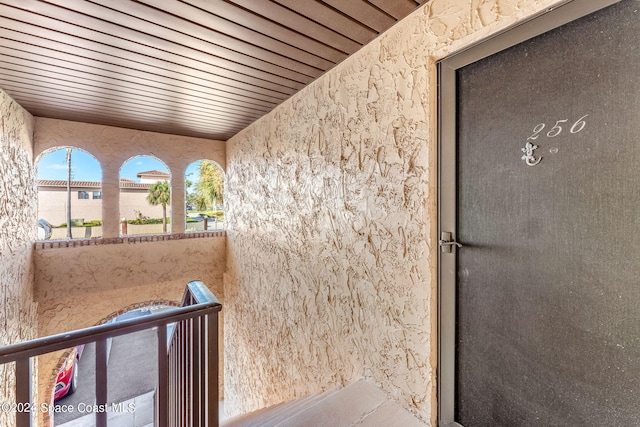 entrance to property with a balcony