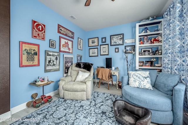 sitting room featuring hardwood / wood-style floors