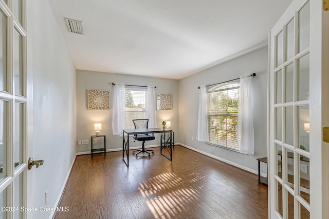 home office featuring dark hardwood / wood-style floors and french doors